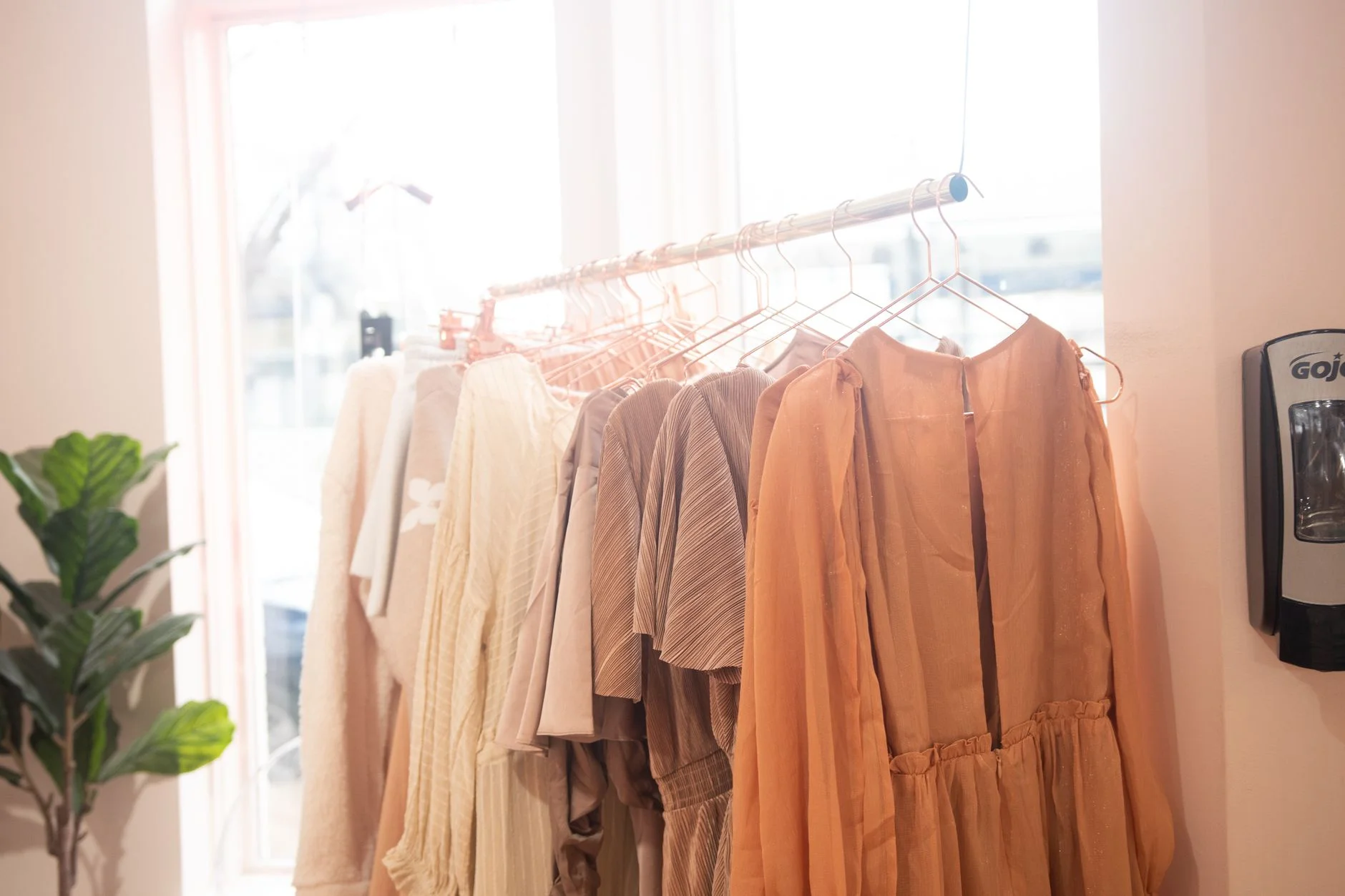 A rack of clothing representing different fashion aesthetics