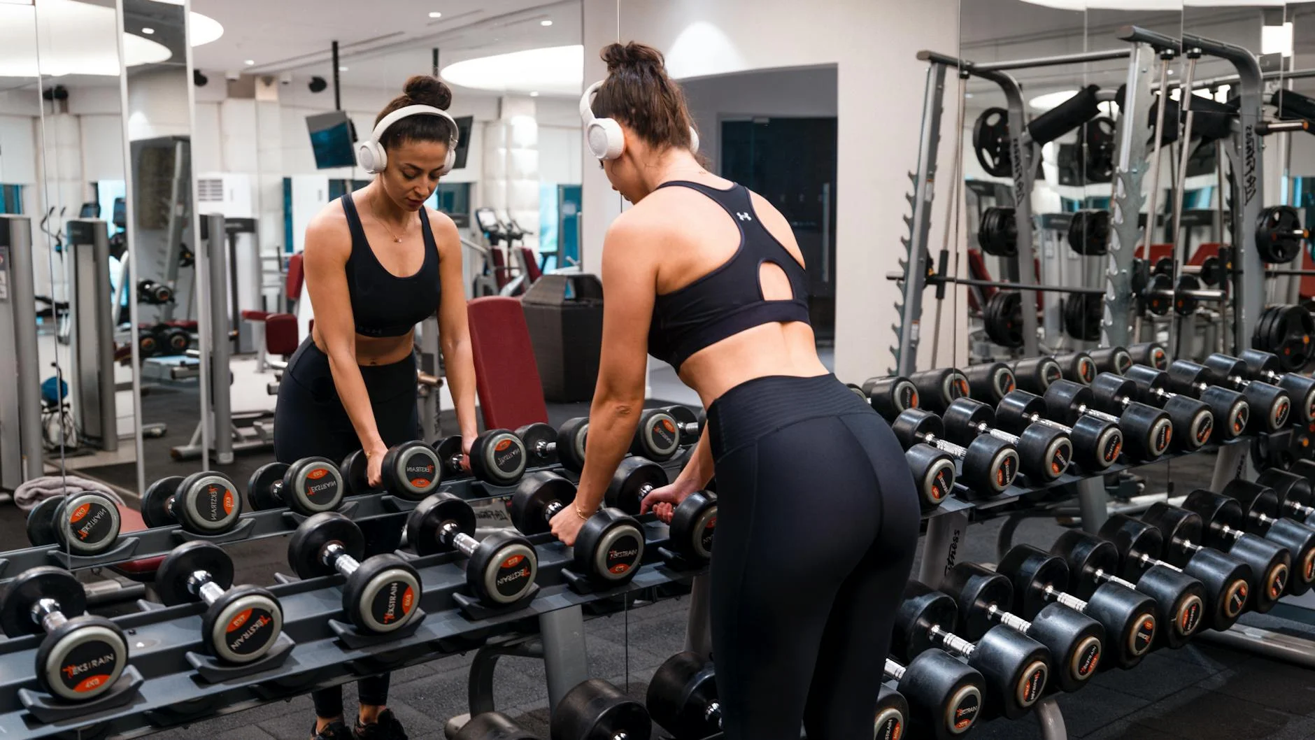 Woman wearing fitted activewear celebrating athletic hourglass figure