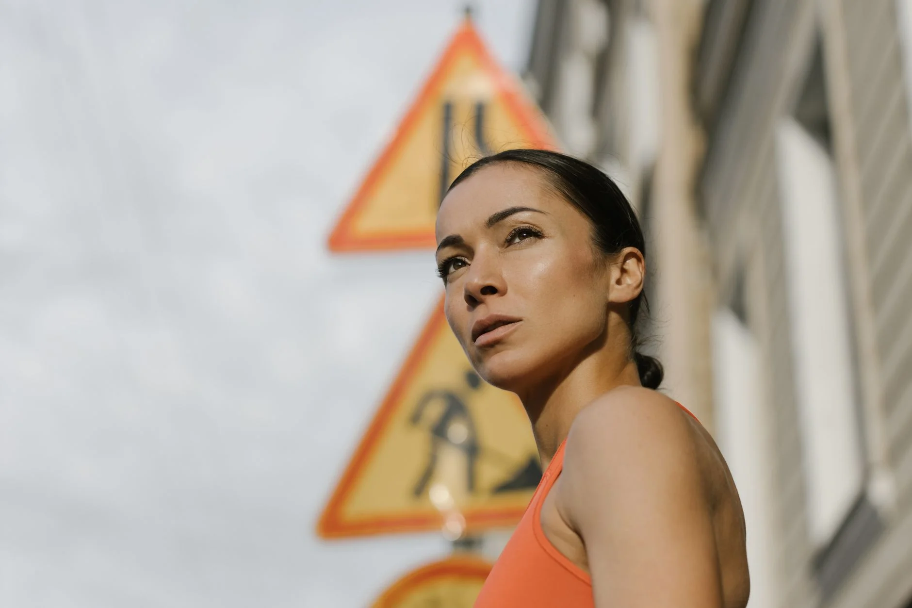 Confident woman with athletic, broad-shouldered proportions wearing a balanced outfit