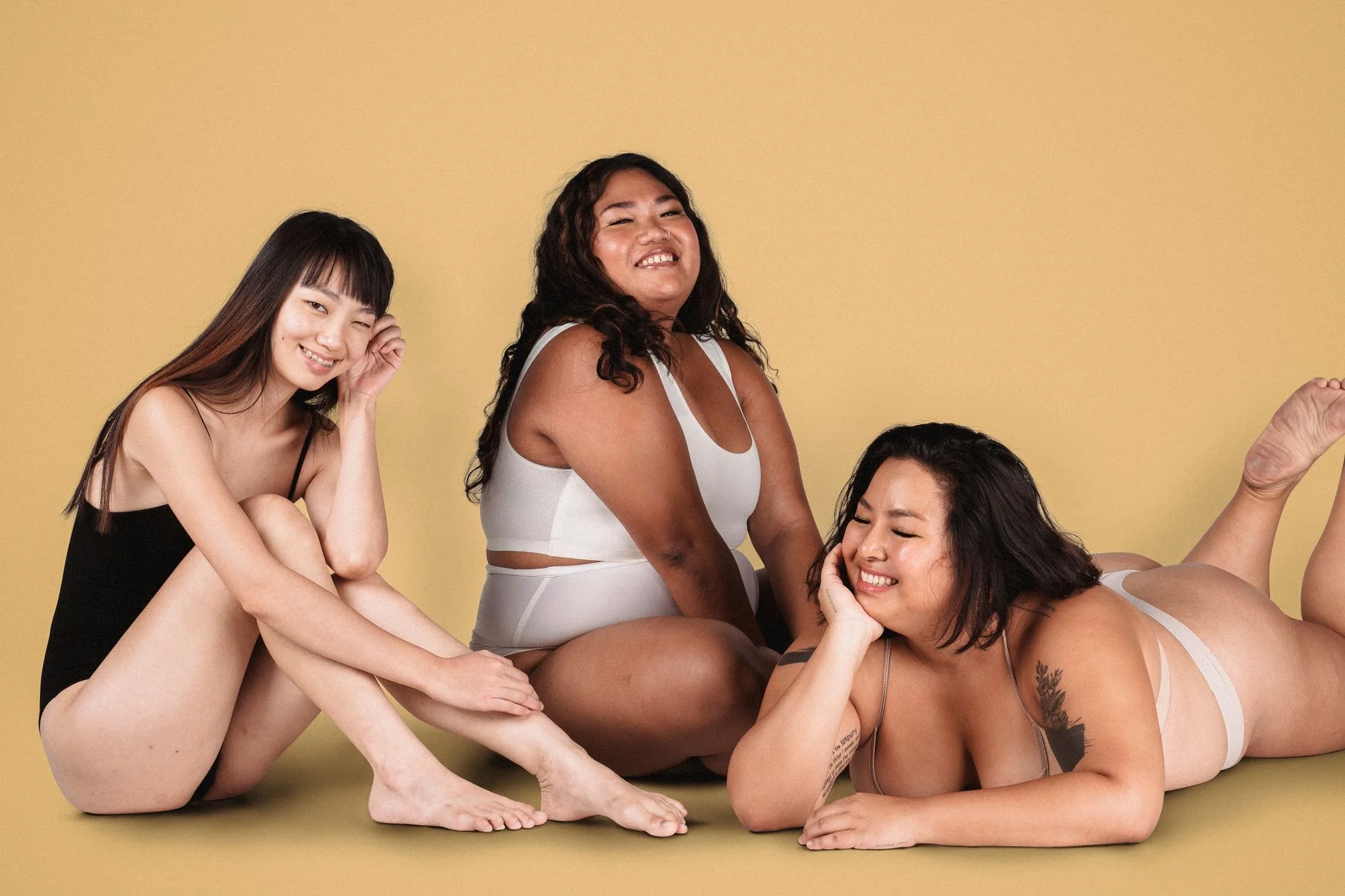 Diverse group of women representing different female body shapes in a fashion studio