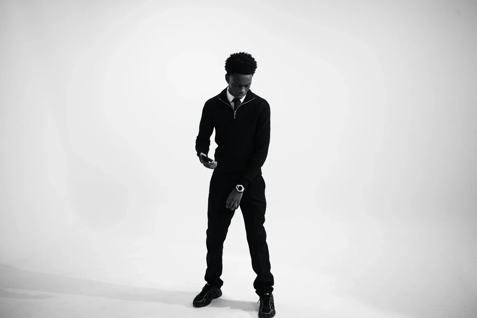 Man standing in a studio setting, illustrating male body shape proportions