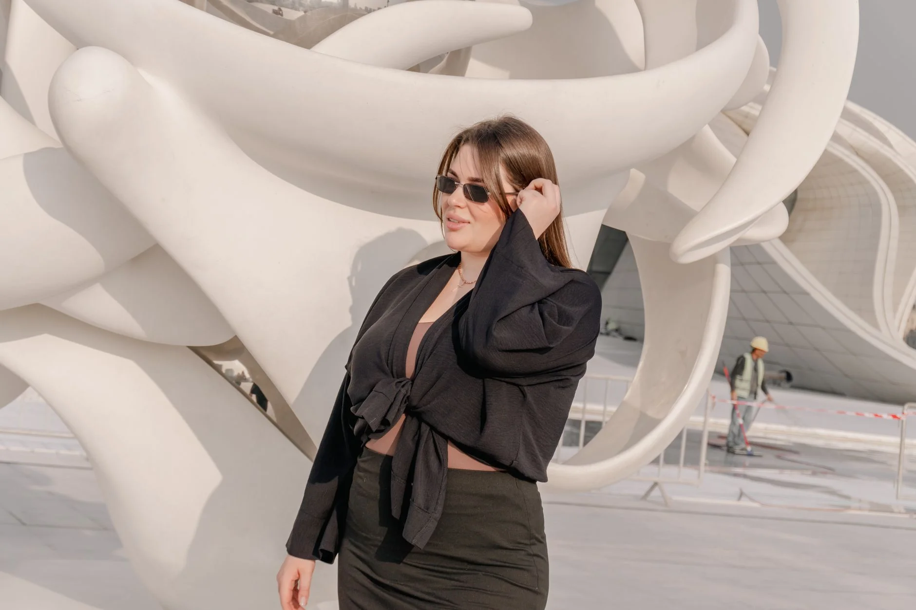 Woman with a curvy hourglass figure and a pear-shaped silhouette shown side by side in stylish outfits