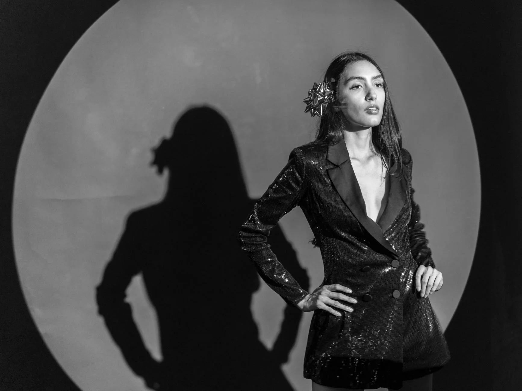 Woman with a rectangle body shape styling a tailored jacket to add definition to her silhouette