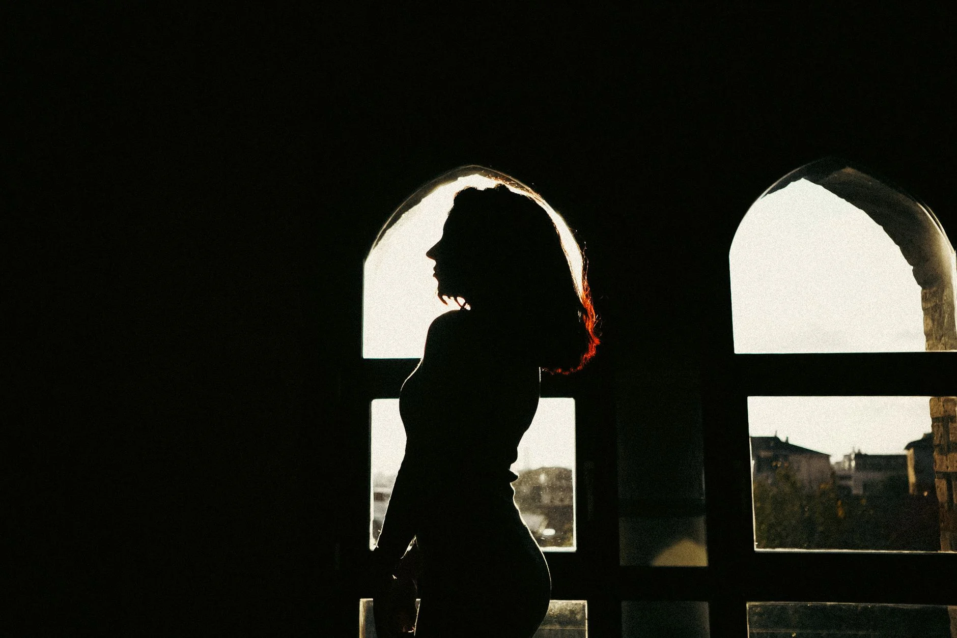 Woman's elegant silhouette outline against backlight, illustrating fashion silhouette shapes