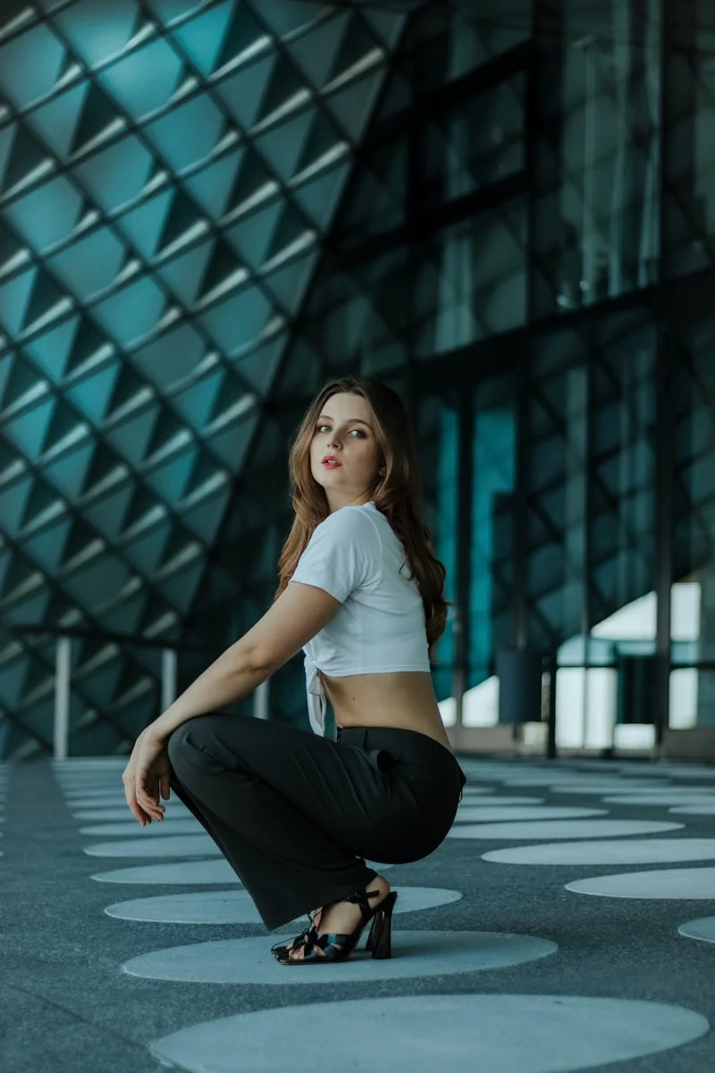 Tall woman with hourglass figure wearing elegant outfit