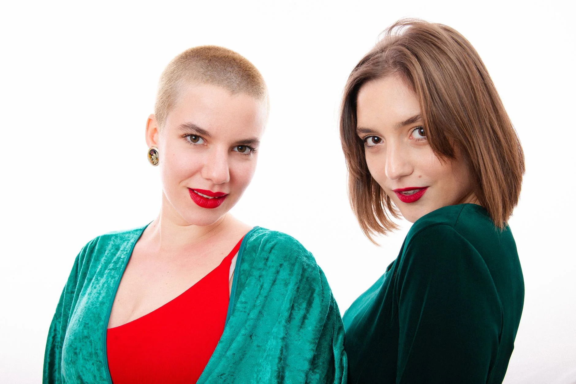 Vivid emerald and true red outfit reflecting the bright, high-contrast Clear Winter color palette