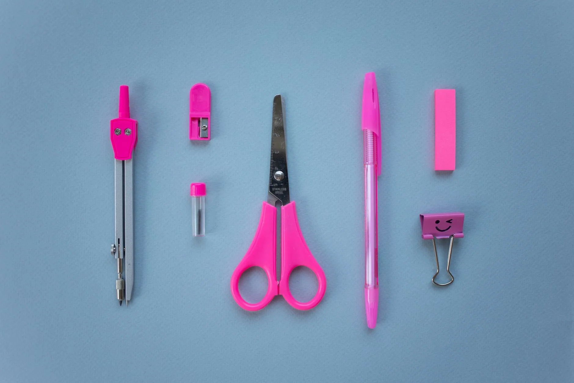 Hot pink and electric blue accessories flatlay in Clear Winter colors