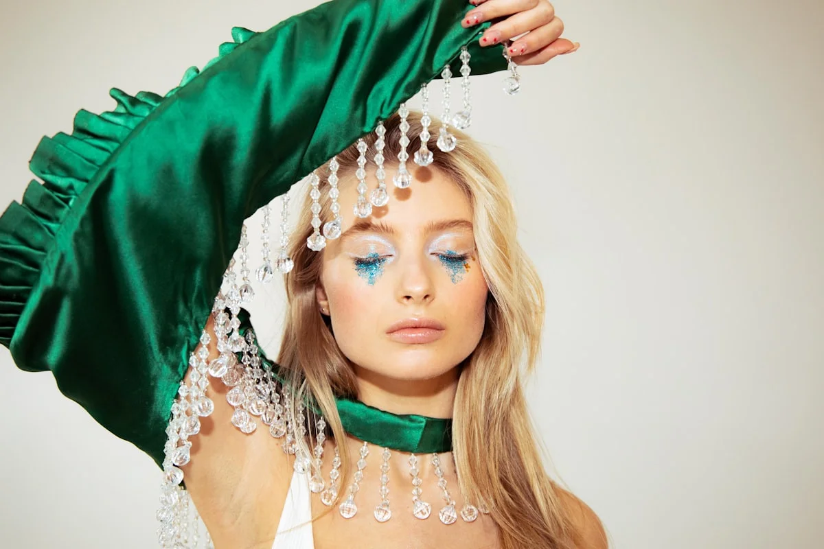 Jewel-tone emerald and sapphire outfit reflecting the cool, deep Deep Winter color palette