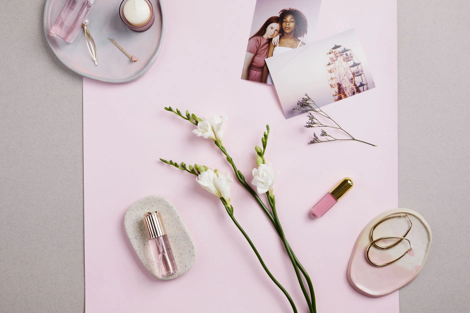 Pale pink and pale blue accessories flatlay in Light Summer colors