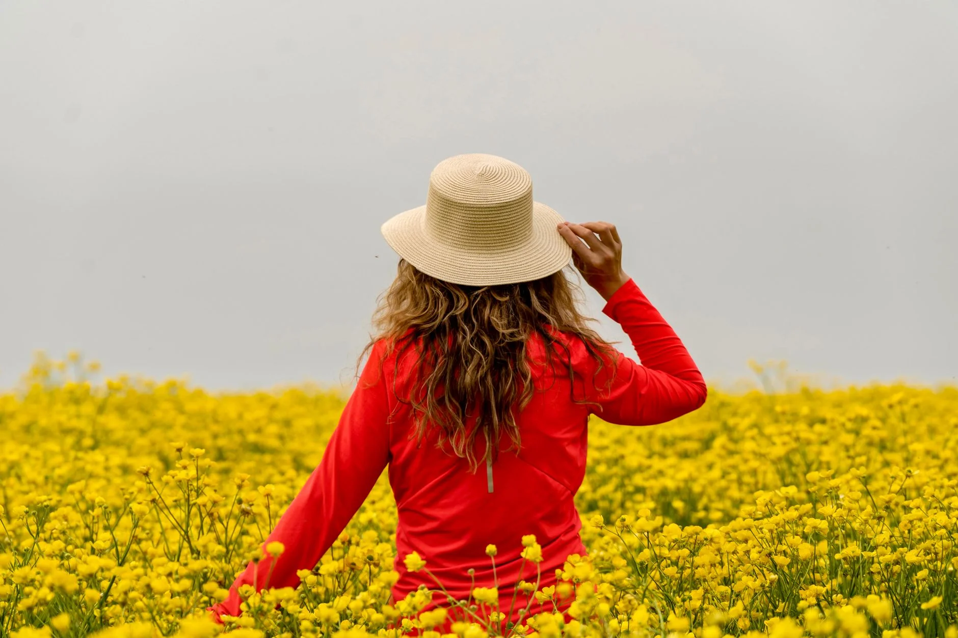 Bright coral and golden yellow outfit reflecting the warm, saturated Warm Spring color palette