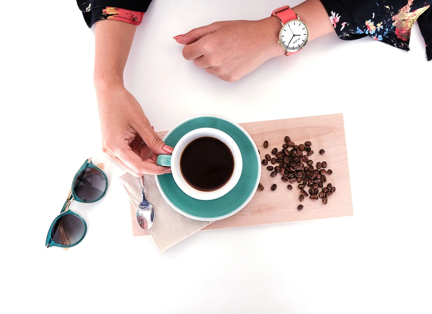 Coral and teal accessories flatlay in Warm Spring colors
