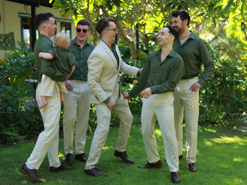 Man wearing a light suit appropriate for a garden party