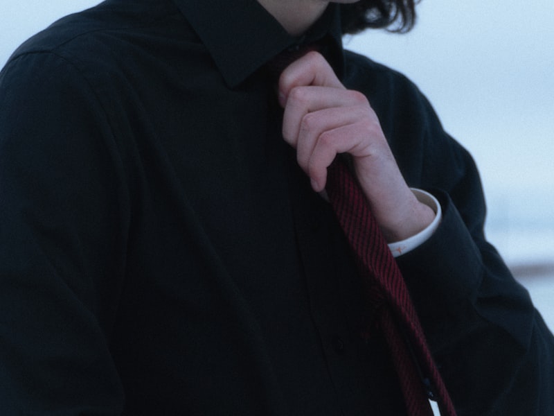 Man wearing a white tie tailcoat, white bow tie, and formal waistcoat