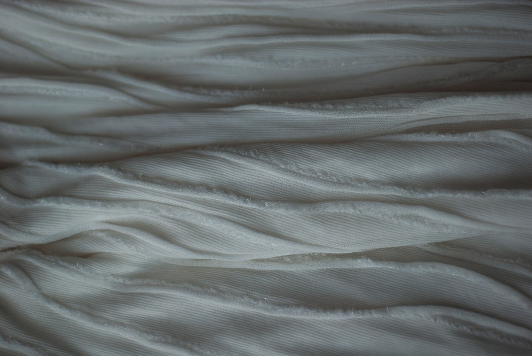 Folded cotton fabric swatches showing a soft, breathable weave