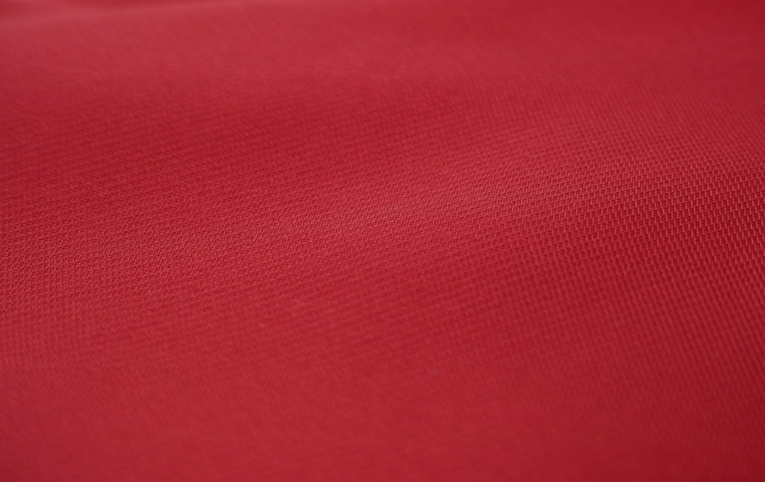 Glossy satin fabric with a smooth, lustrous surface
