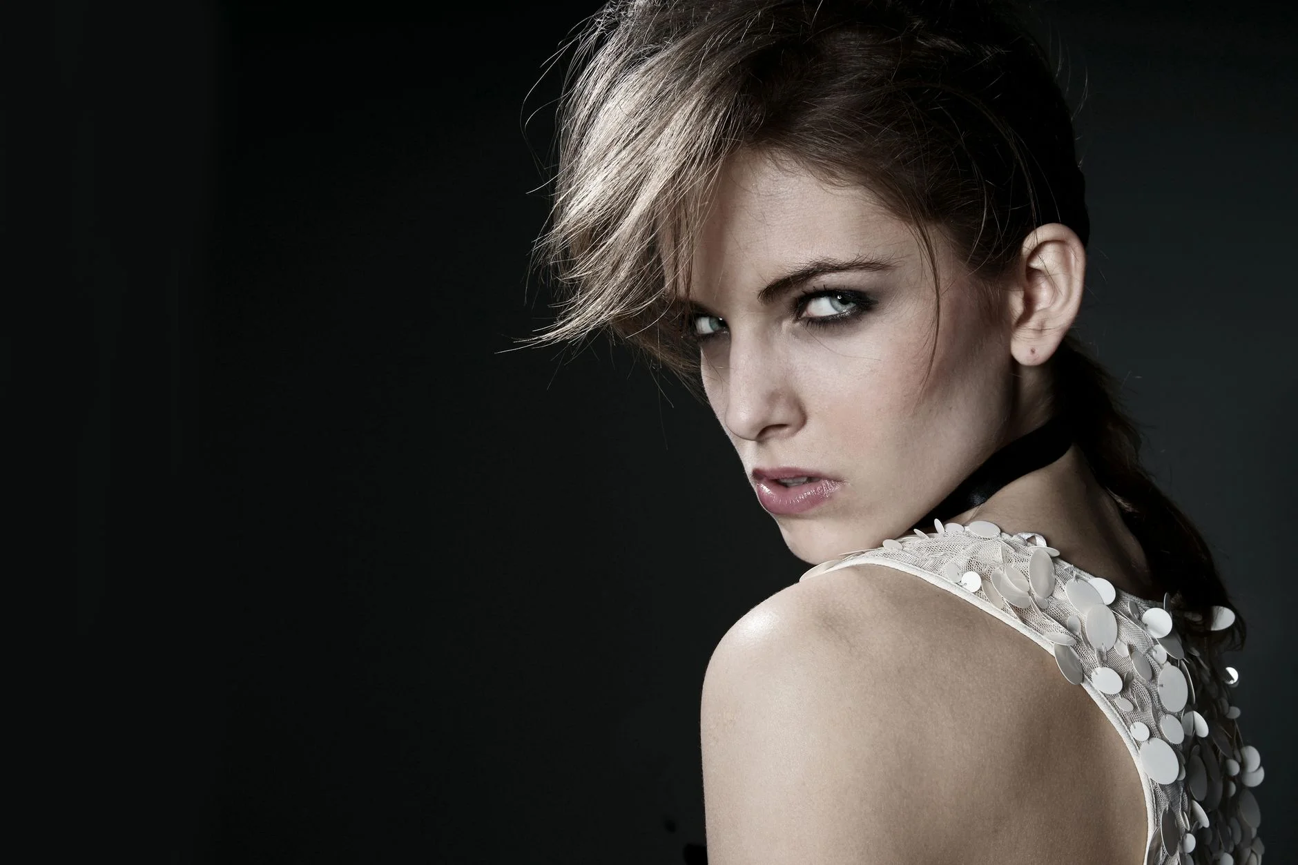 Woman with a diamond face shape, showing prominent cheekbones and a narrower forehead and jaw