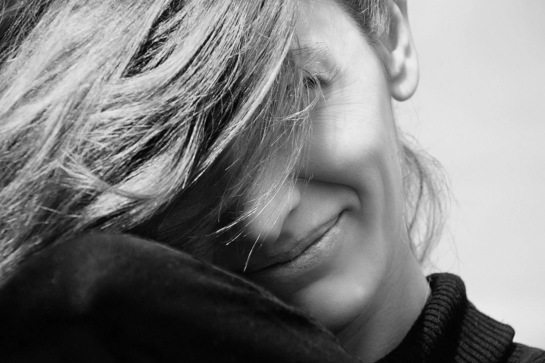 Woman with an oblong face shape, showing a longer face with fairly even width from forehead to jaw