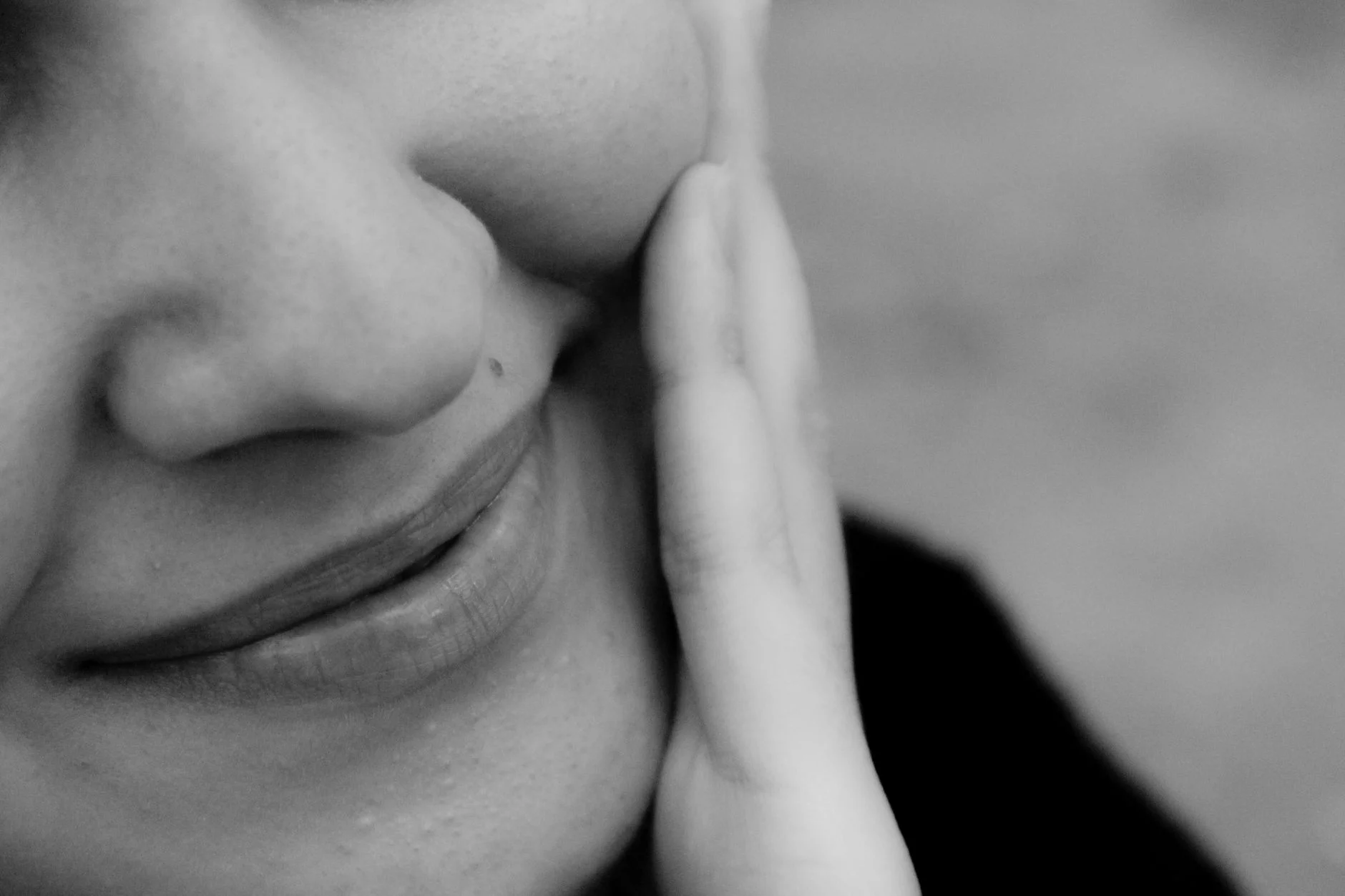 Woman with a round face shape, showing full cheeks and a soft, curved jawline