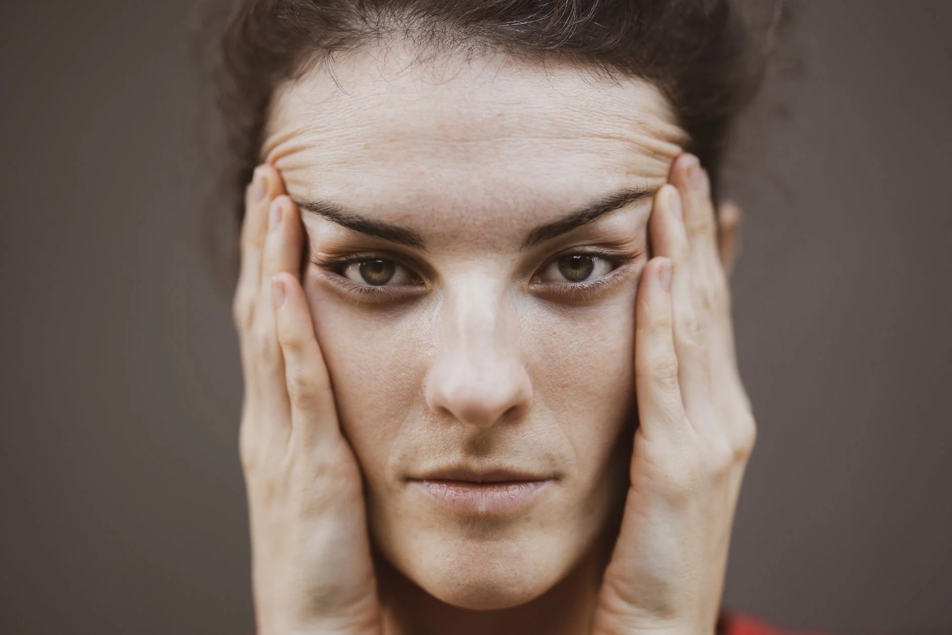 Woman with a triangle face shape, showing a jawline wider than the forehead