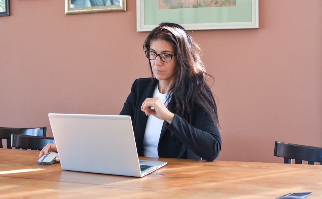 Woman wearing a professional business suit in an office setting