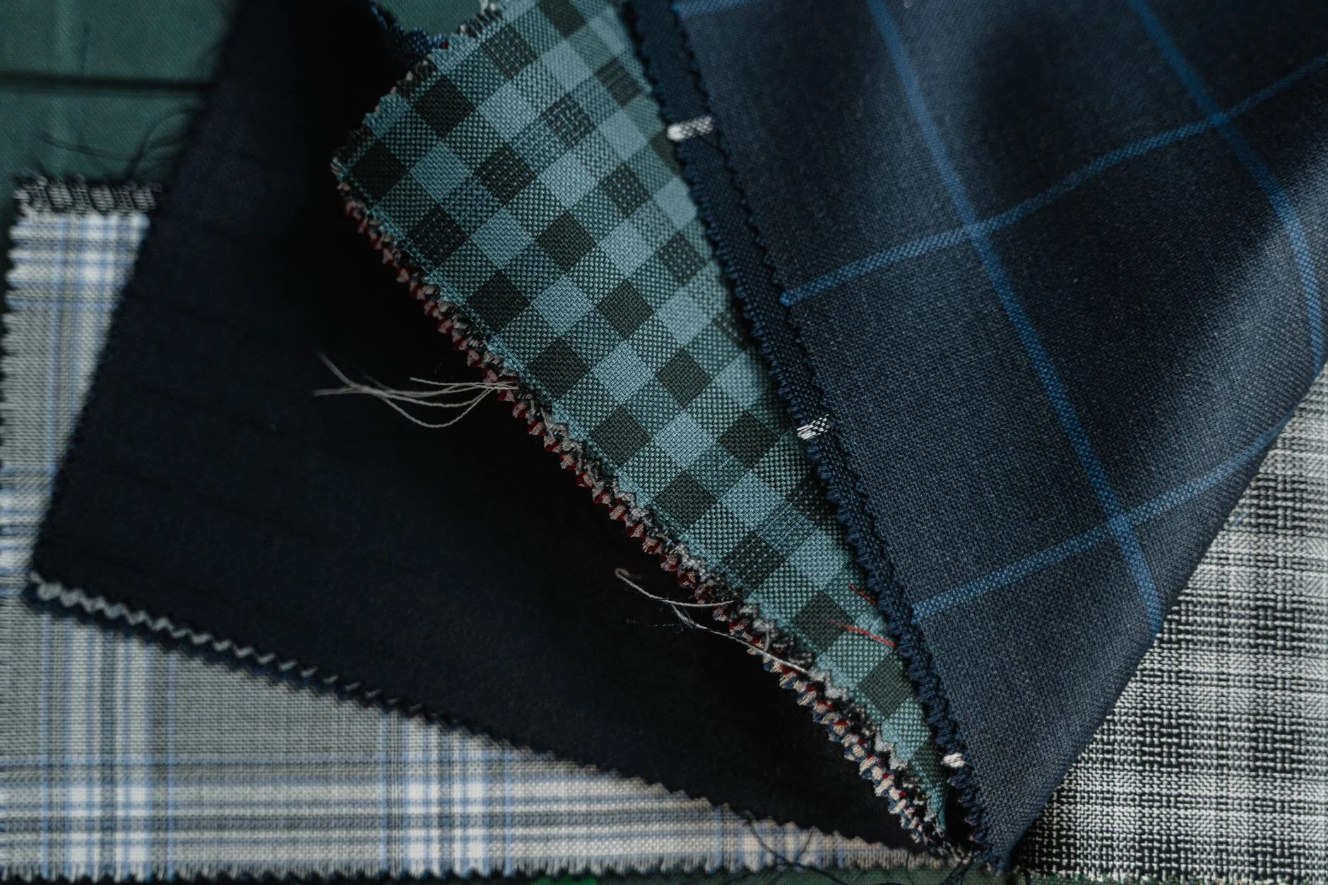 Close-up of assorted fabric textile swatches in a range of textures and colors
