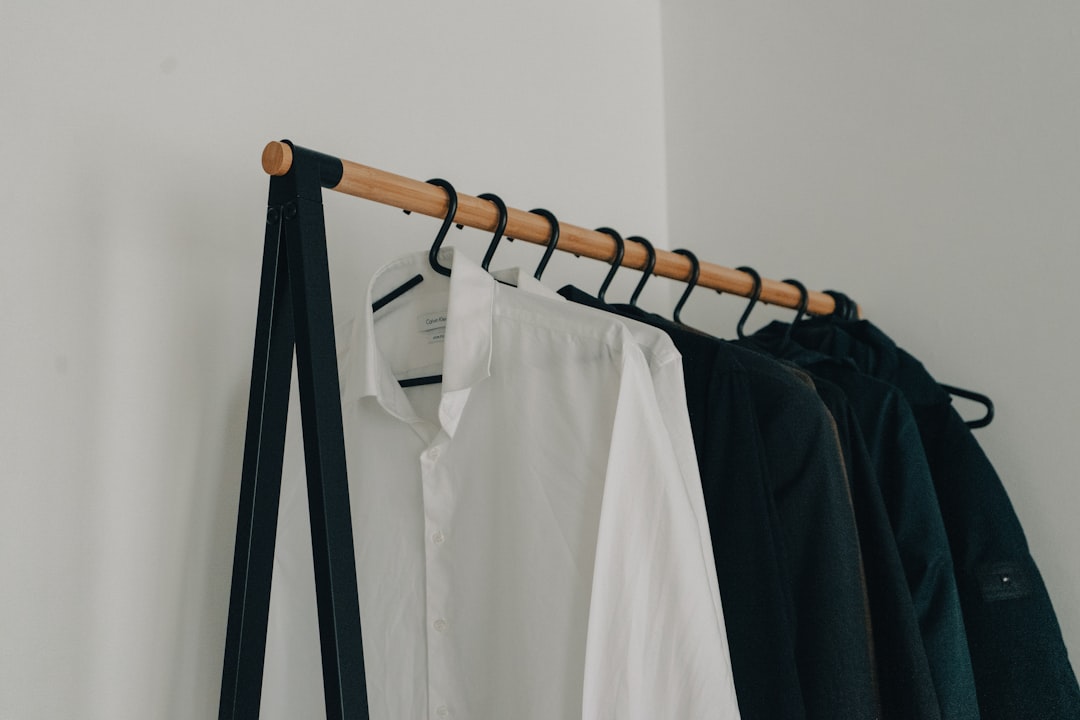 Organized closet with curated clothing on hangers