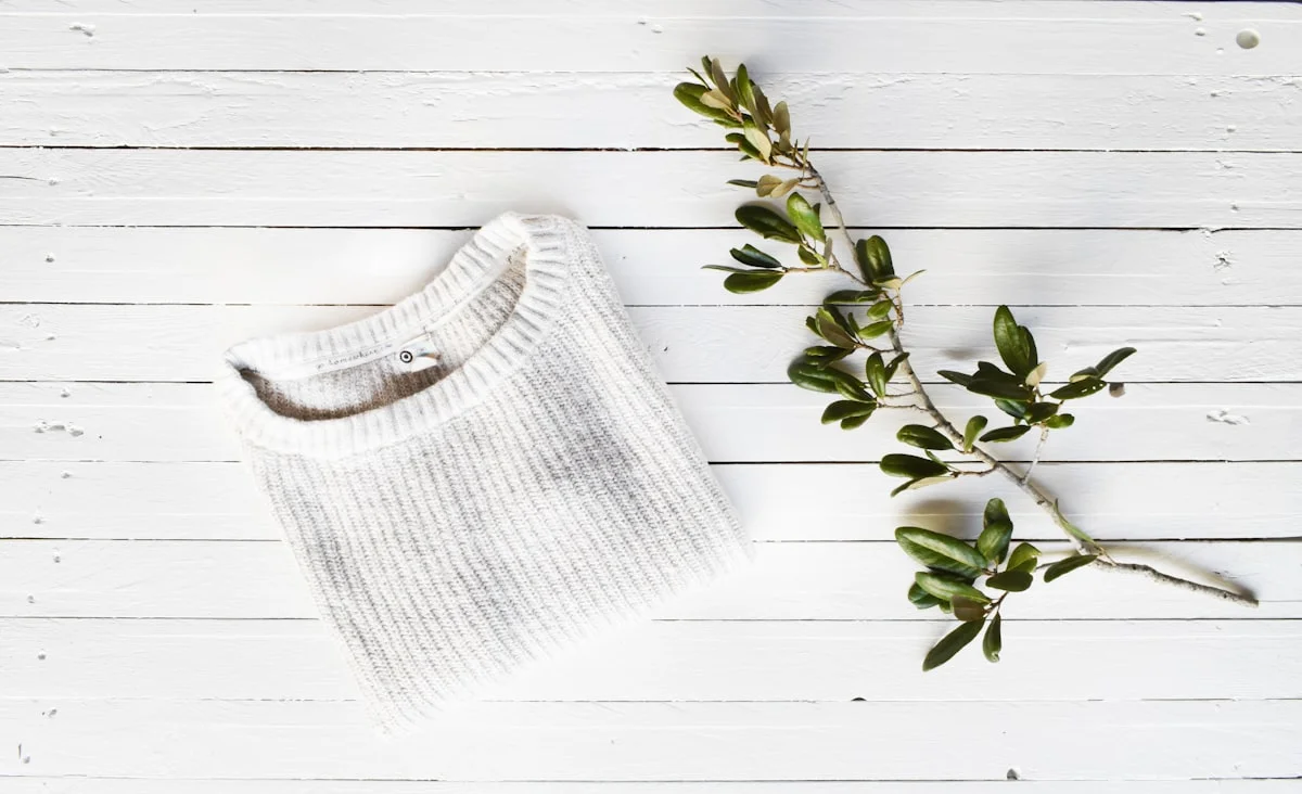 Folded neutral cashmere and wool knitwear in an old money palette