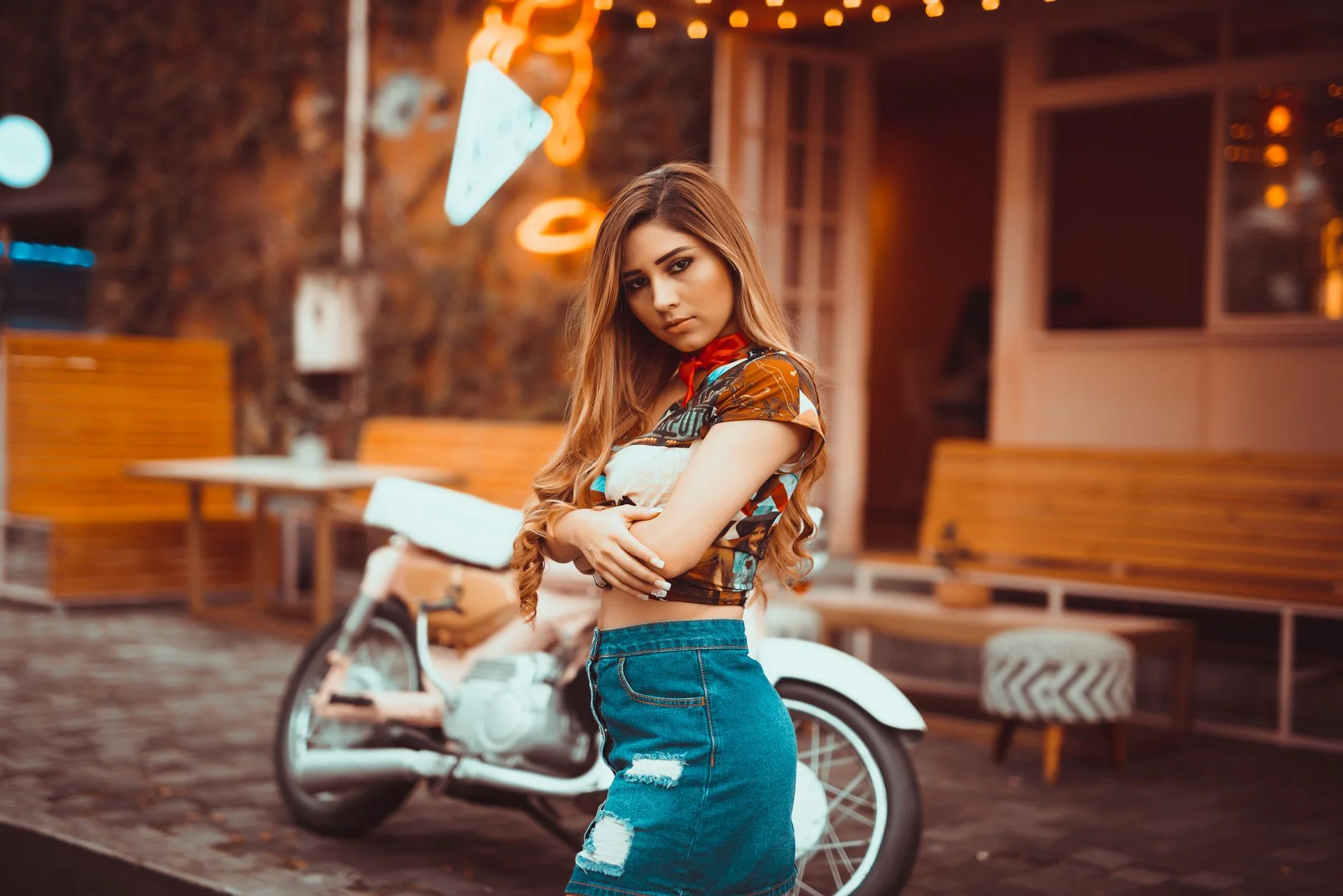 Woman in a cute casual outfit with an eyelet top and relaxed denim