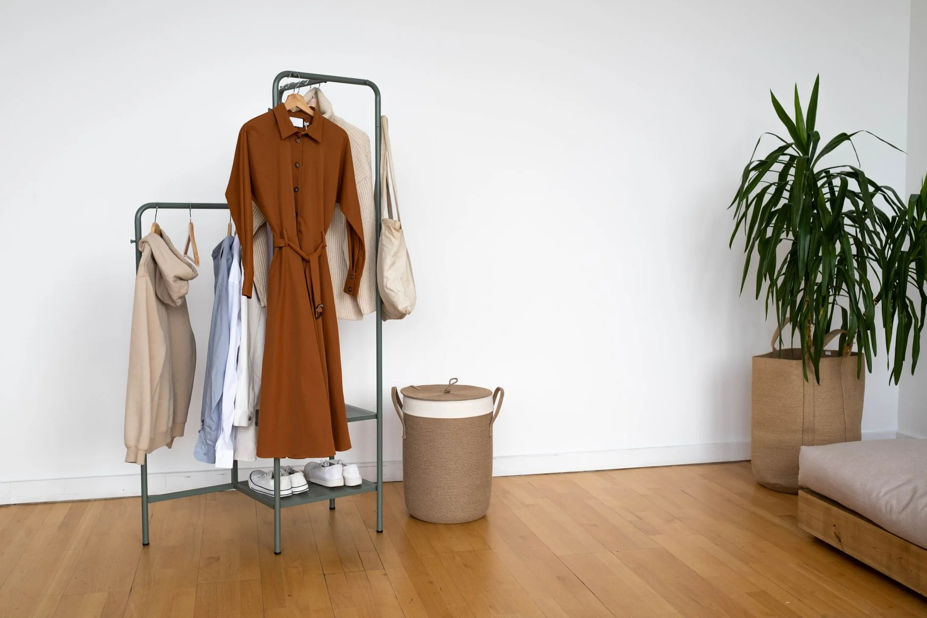 Organized clothing rack with neutral outfits for different occasions