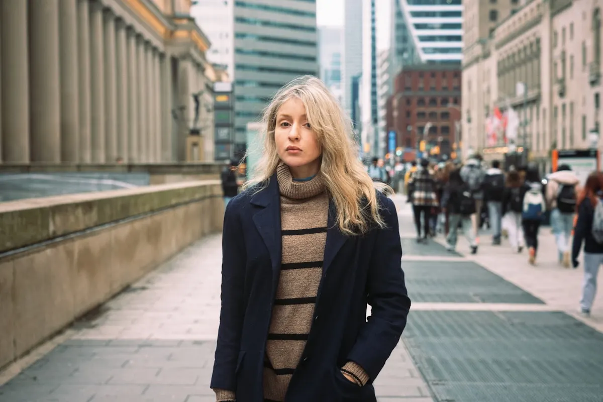 Woman choosing a weather-appropriate layered outfit for the day