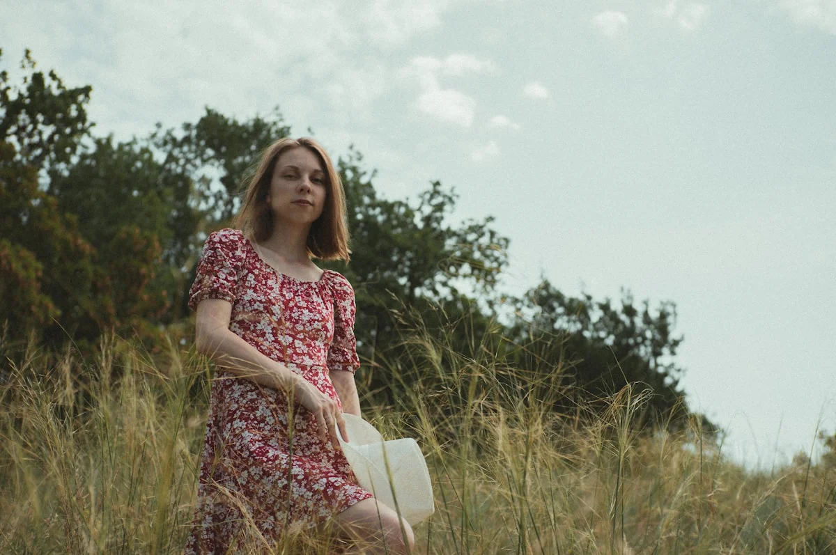 Woman in a floral midi dress dressed for a daytime bridal shower